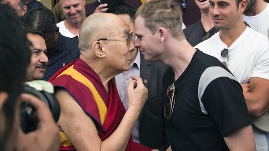 Smith rubs noses with Dalai Lama