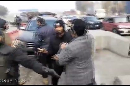Farrukh Habib attempts to stop a police motorcade