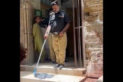 Karachi Police Officer mops floor