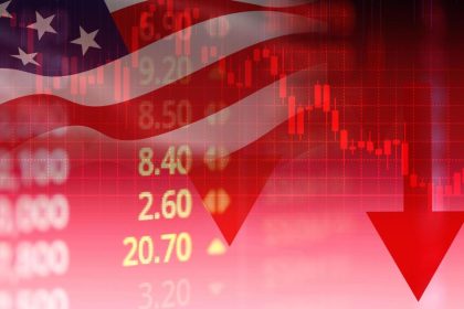 U.S. flag with falling stock market chart and red downward arrow.