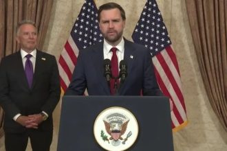 US Vice President JD Vance speaks at a podium during a press appearance following peace talks with Iran in Islamabad.