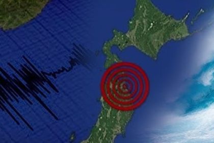 Map of Japan with a red epicentre target, seismic wave graphic, and large ocean wave representing an earthquake and tsunami alert.