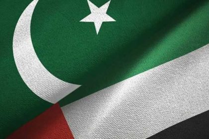 the Pakistani and UAE flags merged side by side, showing the crescent and star of Pakistan and the red, white, green, and black colors of the UAE.