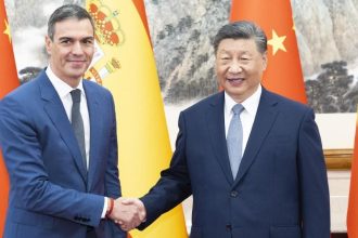Spain's Prime Minister Pedro Sanchez shakes hands with Chinese President Xi Jinping.