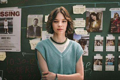 A scene from “A Good Girl’s Guide to Murder” Season 2 shows a young woman standing before an investigation board.
