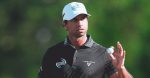 Golfer Aaron Rai holds up a golf ball while standing on the course after his U.S. PGA Championship win at Aronimink Golf Club.
