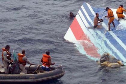 Rescue personnel inspect floating jet wreckage off the coast of Brazil after the aircraft crash.