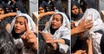 Anmol Pinky appears in a white head covering outside Karachi court, surrounded by police officials.