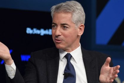 Billionaire hedge fund founder Bill Ackman gestures while speaking at a public event.