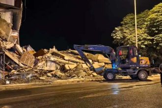A damaged building and piles of debris are seen at night after a 5.2-magnitude earthquake hit Liuzhou’s Liunan district in Guangxi, China.