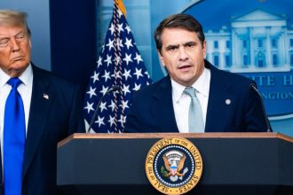 President Donald Trump stands with Todd Blanche, then deputy attorney general, during a 2025 news briefing.