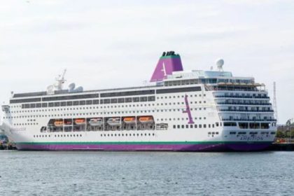 The Ambition cruise ship is docked at a port after being banned from disembarking in Bordeaux, France, as a precaution following reports of 49 people with gastrointestinal sickness and one passenger death.