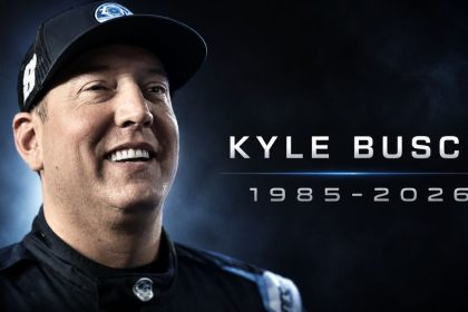 A tribute-style image shows NASCAR champion Kyle Busch smiling, with his name and the years 1985–2026 displayed beside him.