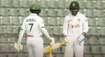 Two Bangladesh cricket players in white Test uniforms stand on the field during the Dutch-Bangla Bank Bangladesh vs Pakistan Test Series 2026.
