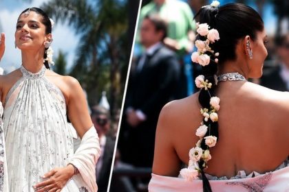Pakistani actor Sanam Saeed poses on the Cannes red carpet in an ivory embellished outfit, paired with sparkling jewellery and a long floral braid.