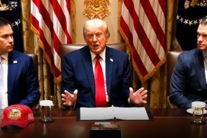 Donald Trump seated between Marco Rubio and Pete Hegseth during a formal meeting.