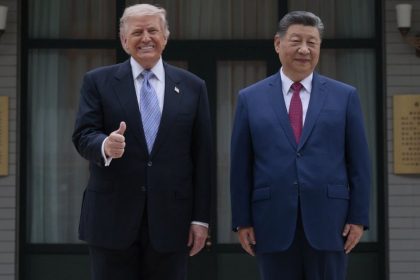President Donald Trump and President Xi Jinping stand side by side for photos at Zhongnanhai Garden in Beijing during the final day of their summit.