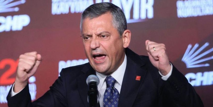 Özgür Özel, leader of Turkey’s Republican People’s Party, speaks into a microphone with raised fists during an event in Ankara.