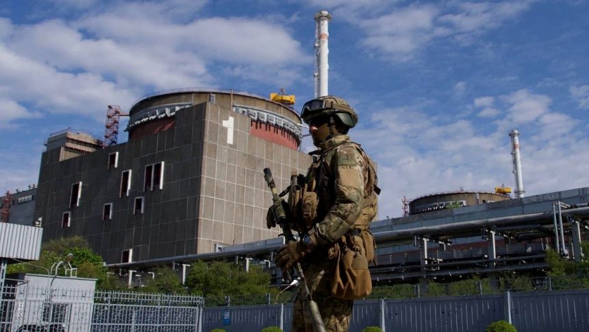 A Russian serviceman patrols outside the Zaporizhzhia Nuclear Power Plant in southeastern Ukraine.