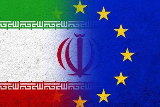 Iran and European Union flags appear in a graphic about EU sanctions linked to Strait of Hormuz maritime traffic.