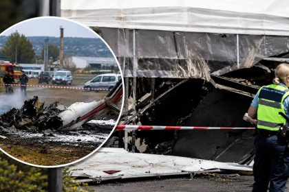 France plane crash site near Nancy in Tomblaine with wreckage, emergency tape and police officer after civilian skydiving aircraft crash.