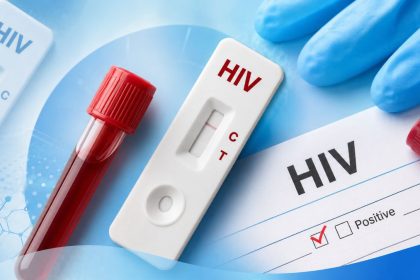Rapid HIV test kit with blood sample tube, medical gloves and HIV test form on a blue clinical background.