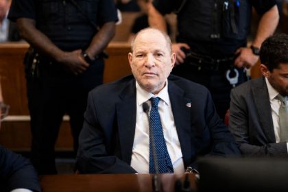 Harvey Weinstein seated in a courtroom during legal proceedings.