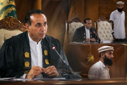Imran Nadeem sits at a desk with microphones during a Gilgit-Baltistan Assembly session.