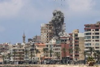 Smoke rises over buildings after Israeli strikes hit Tyre in southern Lebanon on June 9, 2026.