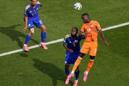 Nicolas Pepe heads the ball near Sherel Floranus and Deveron Fonville during Curacao vs Ivory Coast.