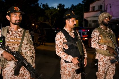 Pakistan Rangers Sindh personnel standing guard at night in Karachi after a reported foiled attack.