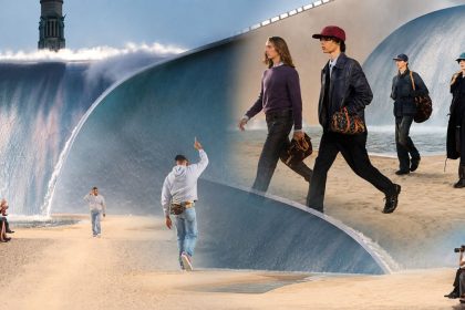 Louis Vuitton Spring Summer 2027 Menswear Show in Paris with models walking beside a giant wave installation.