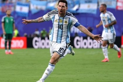 Argentina Algeria World Cup match shows Lionel Messi celebrating after scoring a hat-trick