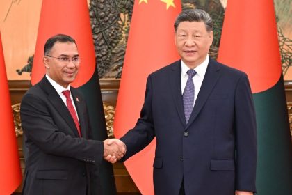 Chinese President Xi Jinping shaking hands with Bangladeshi Prime Minister Tarique Rahman in Beijing.