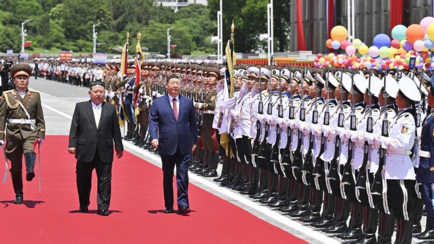 Chinese President Xi Jinping is welcomed in Pyongyang on Monday as he arrives for a state visit to North Korea.