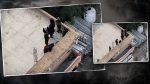 Aerial view of armed individuals on rooftops in Rawalakot, Azad Jammu and Kashmir, during a security operation involving police and security forces.