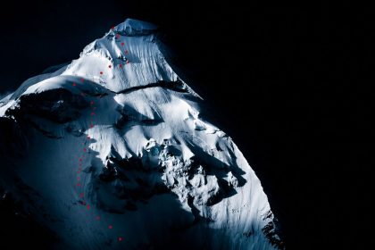 Documentary image of Artesonraju peak showing a ski descent route marked with red dots across the snow-covered mountain.