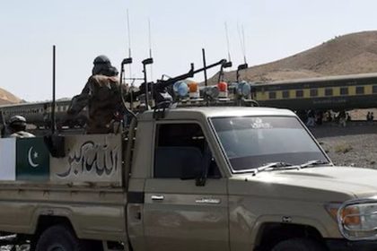 Pakistan Army and Frontier Corps personnel protecting a passenger train in Balochistan.