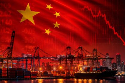 China's national flag over a busy cargo port with shipping containers, cranes, and stock market graphics symbolizing the country's economy and exports.