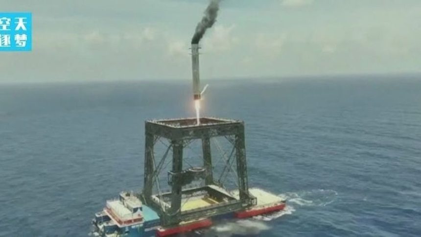 Image ALT Text: Chinese reusable rocket booster lands at sea after Long March-10B flight.
