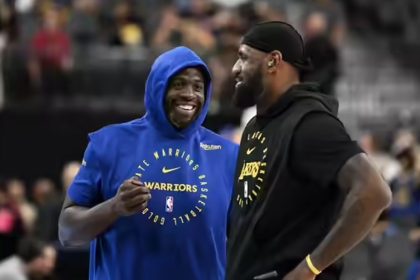 Draymond Green of the Golden State Warriors with Los Angeles Lakers star LeBron James.