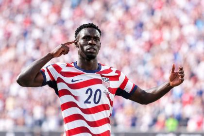 US striker Folarin Balogun celebrating in United States football kit.
