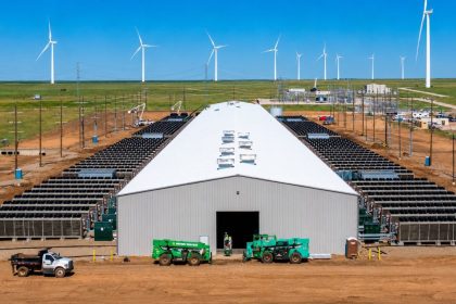 Hut 8 Vega data center operating near wind turbines.