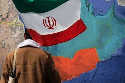 Iran flag over map showing Yemen and nearby Middle East region.