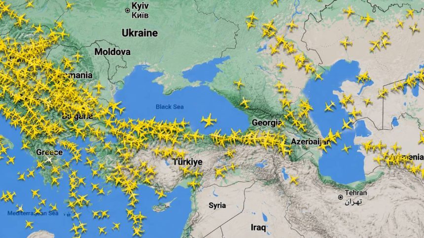 Flight-tracking map shows aircraft routes across the Black Sea and Middle East region.