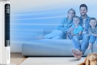 Portable air conditioner provides cool airflow for a family sitting at home during warm weather.