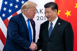 Donald Trump and Xi Jinping shake hands at the 2019 G20 summit in Osaka