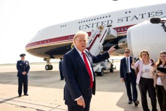 President Donald Trump speaking to reporters before boarding the new Air Force One.