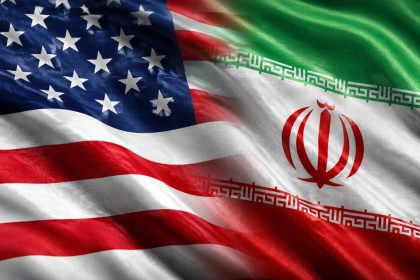 U.S. and Iran flags shown in diplomatic tension graphic.