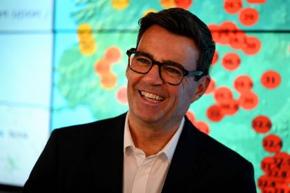 UK PM Andy Burnham smiling at an event.